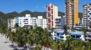 a view of a city with palm trees and buildings at Apartaestudio Vista azul rodadero Mara 502 in Santa Marta