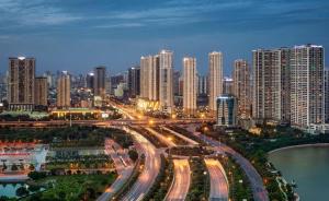 a city at night with traffic on a freeway at Dcapitale - Feria Homes in Hanoi