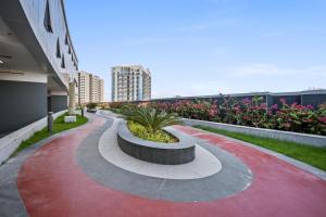 a red carpeted walkway with a bench on a building at Hidden Gem Studio - Affordable in Dubai