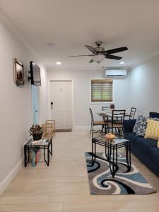 a living room with a couch and a table at Sheer Bliss BeachView Apt #3 in Georgetown
