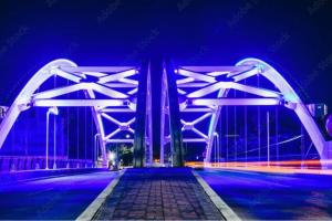 a bridge lit up at night with blue and purple at Heart of Houston NRG/TMC Beautiful Studio 77030 in Houston