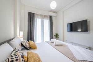 Ένα ή περισσότερα κρεβάτια σε δωμάτιο στο Supreme Athens Home by Cloudkeys