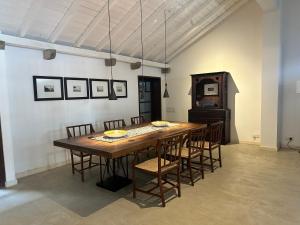 a dining room with a table and chairs at 89 Leyn Baan by AQUA Villa in Galle