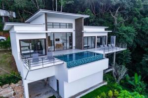 an aerial view of a house with a swimming pool at Great Sea View Mountain Villa Koh samui in Amphoe Koh Samui