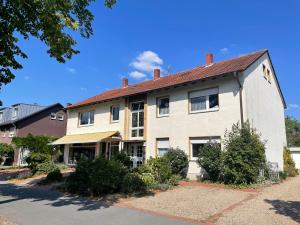 a large white building with a red roof at Apartment FeWo54 FreeWifi, Free Parking, SmartTV in Hamm