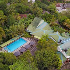an aerial view of a resort with a swimming pool at Hotel Ranthil in Galle