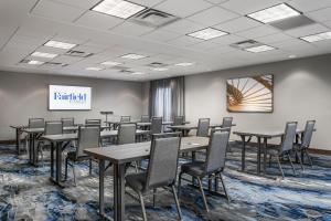 a conference room with tables and chairs and a screen at Fairfield Inn & Suites by Marriott Chattanooga South East Ridge in Chattanooga +39 photos