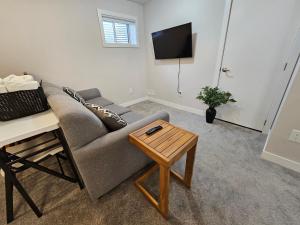 a living room with a couch and a table at RB Homes in Ottawa