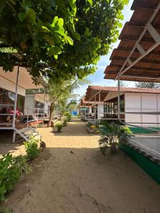 an empty courtyard of a school with a building at Mountain Palm patnem beach in Patnem