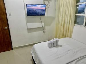 Postel nebo postele na pokoji v ubytování Hostal Viva Mar