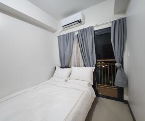 Postel nebo postele na pokoji v ubytování Bloom Residences Condo 2Br + 37 fotografií