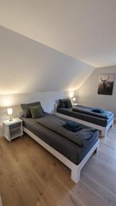 Ein Bett oder Betten in einem Zimmer der Unterkunft Ferienhaus Dhrontal