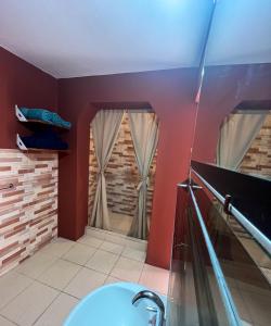 a bathroom with a sink and a bath tub at Los Velitos in Santa Rosa del Conlara