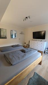 Ein Bett oder Betten in einem Zimmer der Unterkunft Ferienhaus Dhrontal