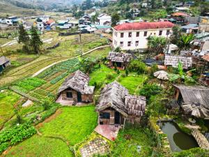 an aerial view of a village with houses at Sapa Thoc House in Sapa