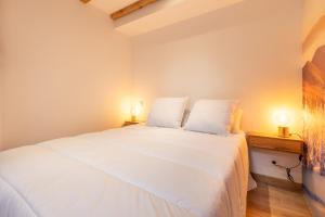 Posteľ alebo postele v izbe v ubytovaní Le Repaire des Écureuils - Appt avec terrasse