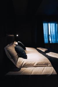 Postel nebo postele na pokoji v ubytování Brim Hotel