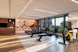 a gym with treadmills and exercise bikes in a room at IntercityHotel Shanghai New International Expo Center in Shanghai