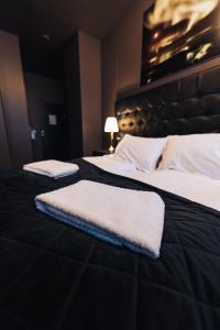 Postel nebo postele na pokoji v ubytování Brim Hotel