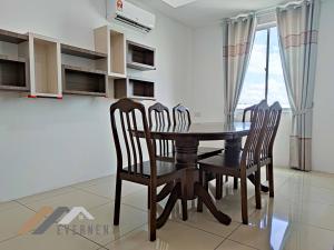 a dining room with a table and four chairs at Serene Heights by Evernent in Miri