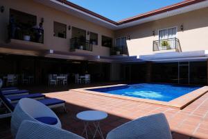 a large swimming pool in the middle of a building at Sierra Hotel in Dumaguete