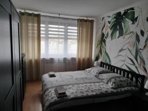 Łóżko lub łóżka w pokoju w obiekcie Apartamenty Częstochowa