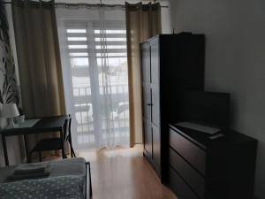 Telewizja i/lub zestaw kina domowego w obiekcie Apartamenty Częstochowa