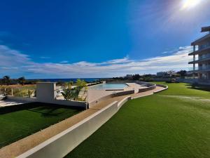 an external view of a house with a swimming pool at Emerald Suites in Protaras