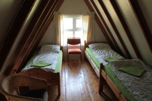 a small room with two beds and a window at Hömluholt Holiday Homes in Hömluholt +46 photos