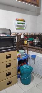 a kitchen with a stove and a counter with dishes at My house in Rabat