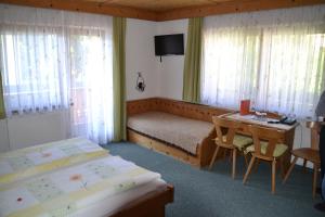 Postel nebo postele na pokoji v ubytování Gästehaus Christoph