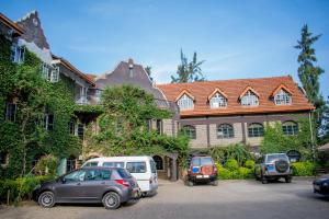 a group of cars parked in front of a building at 17 Arabella Haven near Waterfront in Karen