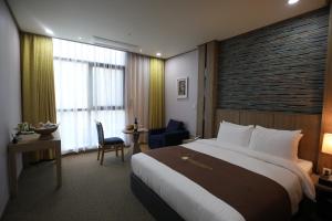 Postel nebo postele na pokoji v ubytování Benikea hotel seosan