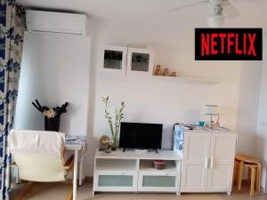 A television and/or entertainment centre at CARPE DIEM Studio