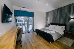 Posteľ alebo postele v izbe v ubytovaní Rado Hotel Spa