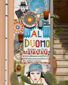 un poster per un festival di fiori con cactus di Al Duomo Rooms & Flats a Taormina