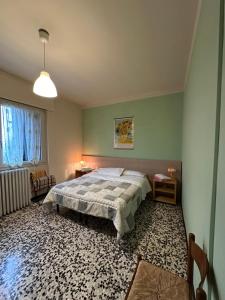 Postel nebo postele na pokoji v ubytování B&B Orchidea Bianca