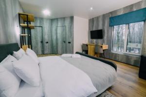 Posteľ alebo postele v izbe v ubytovaní Rado Hotel Spa