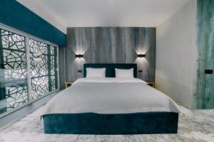 Posteľ alebo postele v izbe v ubytovaní Rado Hotel Spa