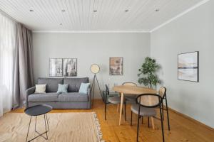 a living room with a couch and a table at limehome Dresden Tannenstraße in Dresden