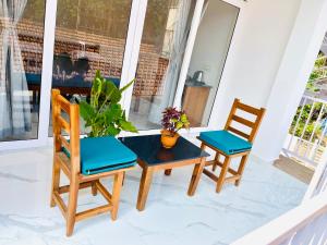 two chairs and a table on a porch at Crystall Goa Palolem in Palolem