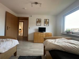 Postel nebo postele na pokoji v ubytování Ferienwohnung mit Balkon DG
