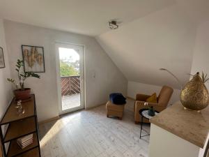 Posezení v ubytování Ferienwohnung mit Balkon DG