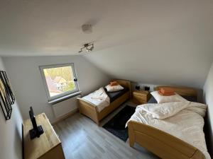 Postel nebo postele na pokoji v ubytování Ferienwohnung mit Balkon DG