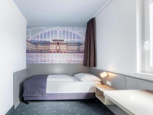 Voodi või voodid majutusasutuse B&B Hotel Mannheim-Neuostheim toas
