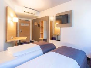 Voodi või voodid majutusasutuse B&B Hotel Mannheim-Neuostheim toas