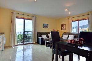 a living room with a couch and a table at Belair Tazacorte in Tazacorte