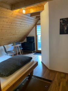 a bedroom with a bed with a wooden ceiling at Vogelbacher Hof - Dachsberg im Südschwarzwald 