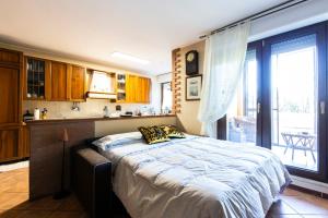 a bedroom with a large bed in a kitchen at Cooperazione 120 in Rozzano