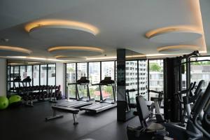 a gym with a bunch of tread machines in a building at 2 beds bangkok center max 6 in Klong Toi